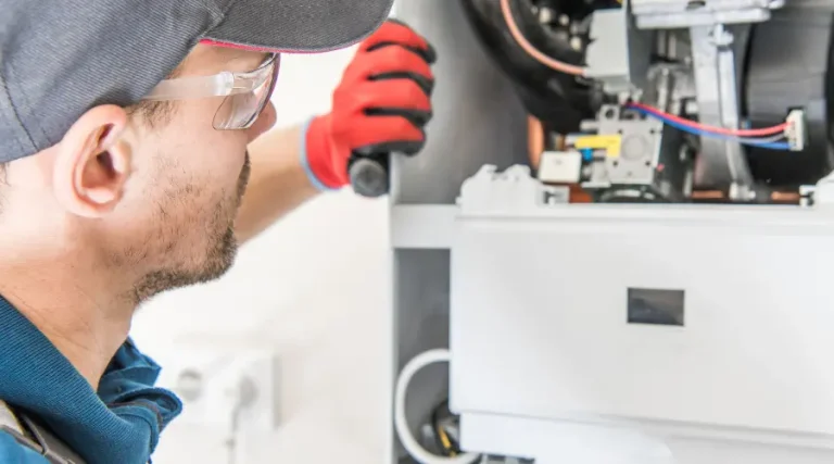 man fixing the water heater maintenance