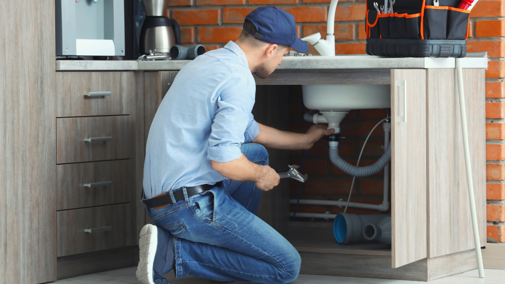 The man is doing Plumbing Upgrades